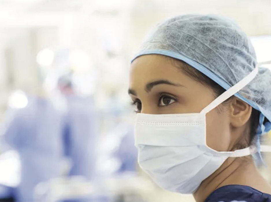 Healthcare professional wearing disposable face protection